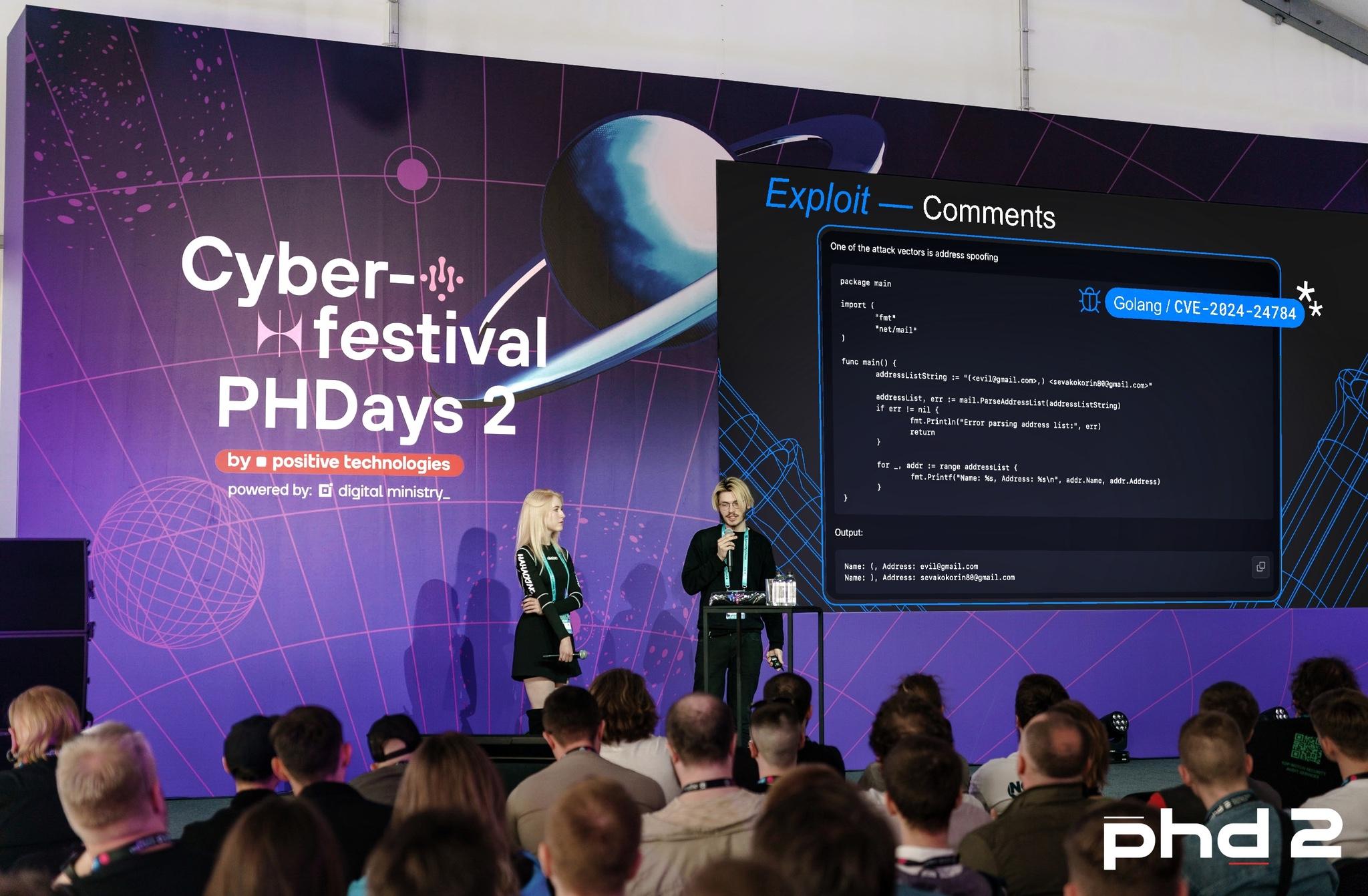 Vsevolod and Elizabeth giving a talk about attacks on modern email services at Positive Hack Days 2024